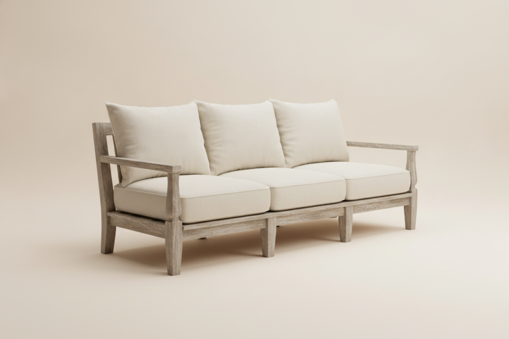 Three-seat teak outdoor sofa with cream linen cushions